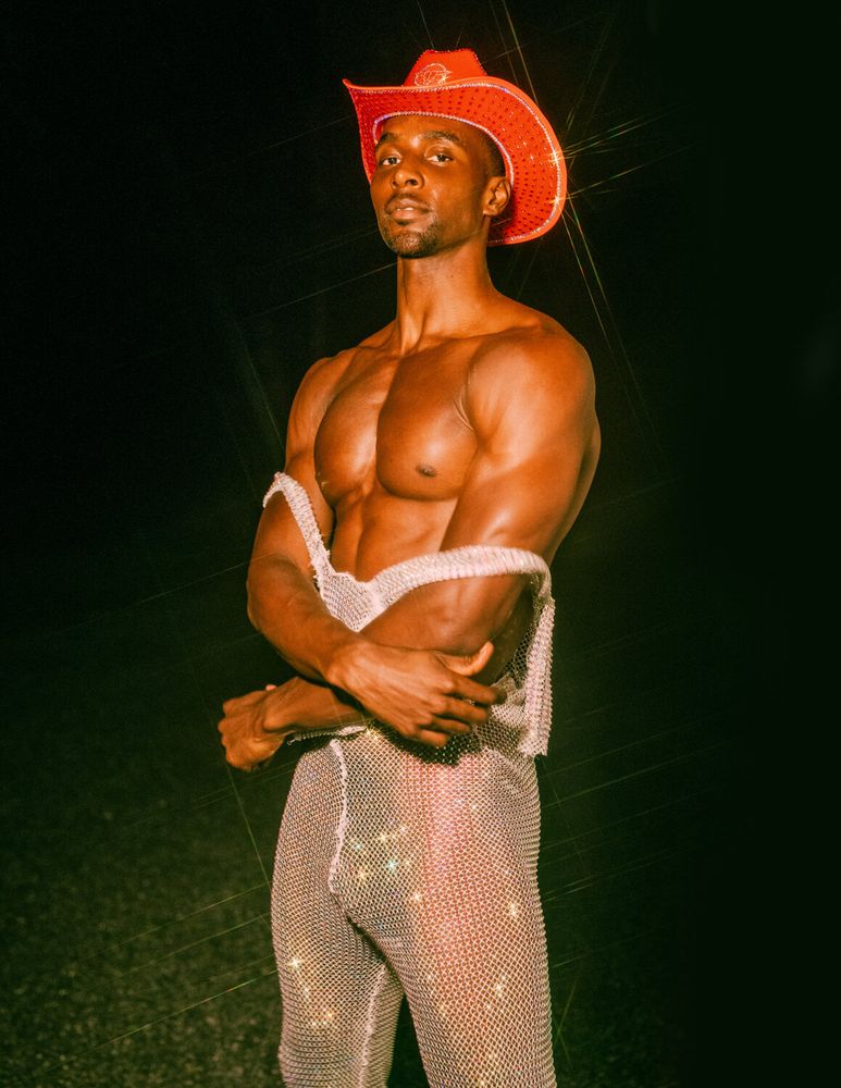Model Joshua Cummings, wearing a rhinestone body suit, photographed for L'Officiel Hommes shot by photographer Taylor Miller.