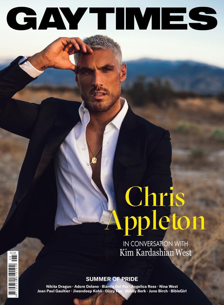 Celebrity Hairstylist Chris Appleton, wearing a black suit, photographed for Gay Times by photographer Taylor Miller.