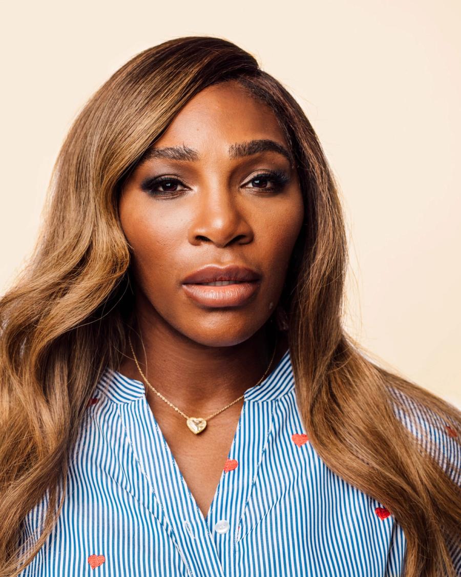 Tennis superstar Serena Williams, wearing a blue and white striped blouse, photographed for BuzzFeed in New York City by Taylor Miller, a celebrity and fashion photographer.
