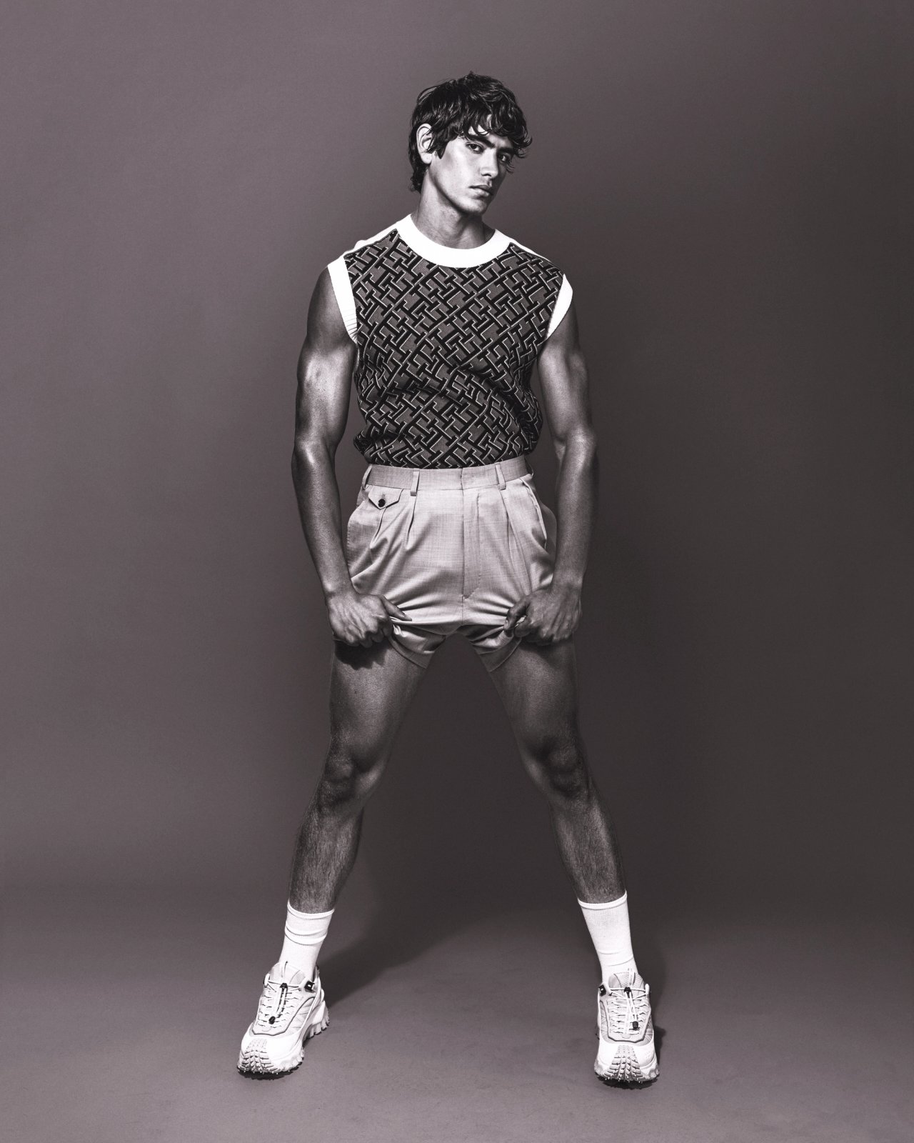 Model Sergio Perdomo, wearing a tank and shorts, photographed for Numéro Netherlands shot by photographer Taylor Miller.