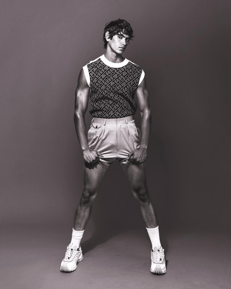 Model Sergio Perdomo, wearing a tank and shorts, photographed for Numéro Netherlands shot by photographer Taylor Miller.