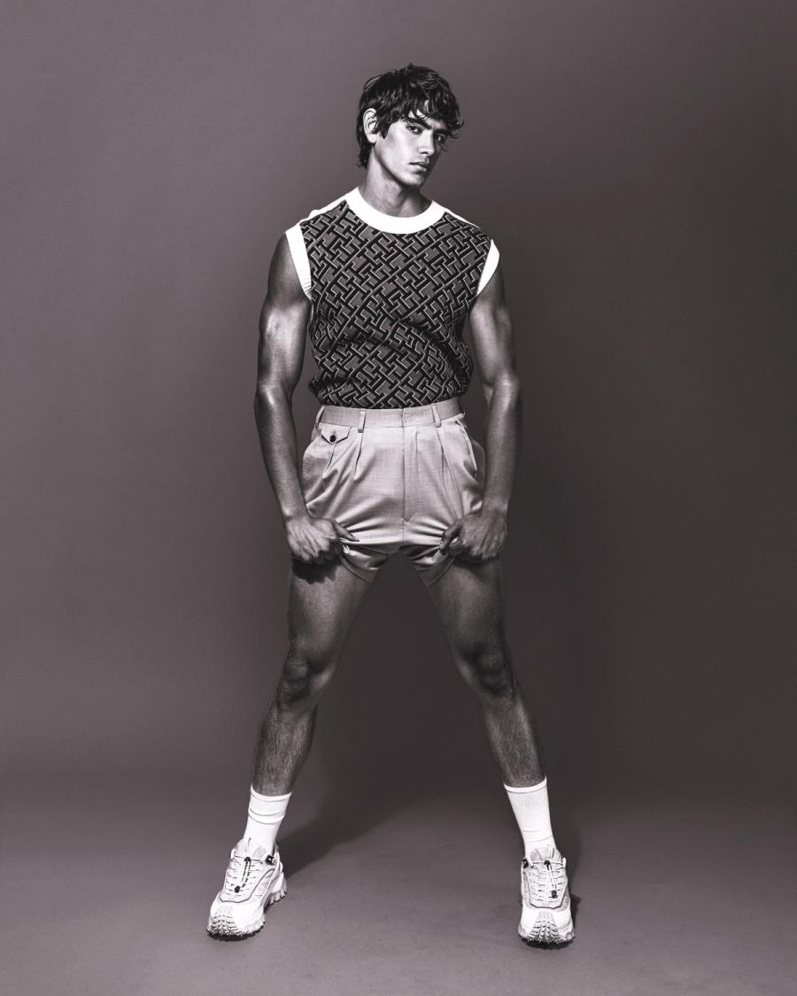 Model Sergio Perdomo, wearing a tank and shorts, photographed for Numéro Netherlands shot by photographer Taylor Miller.