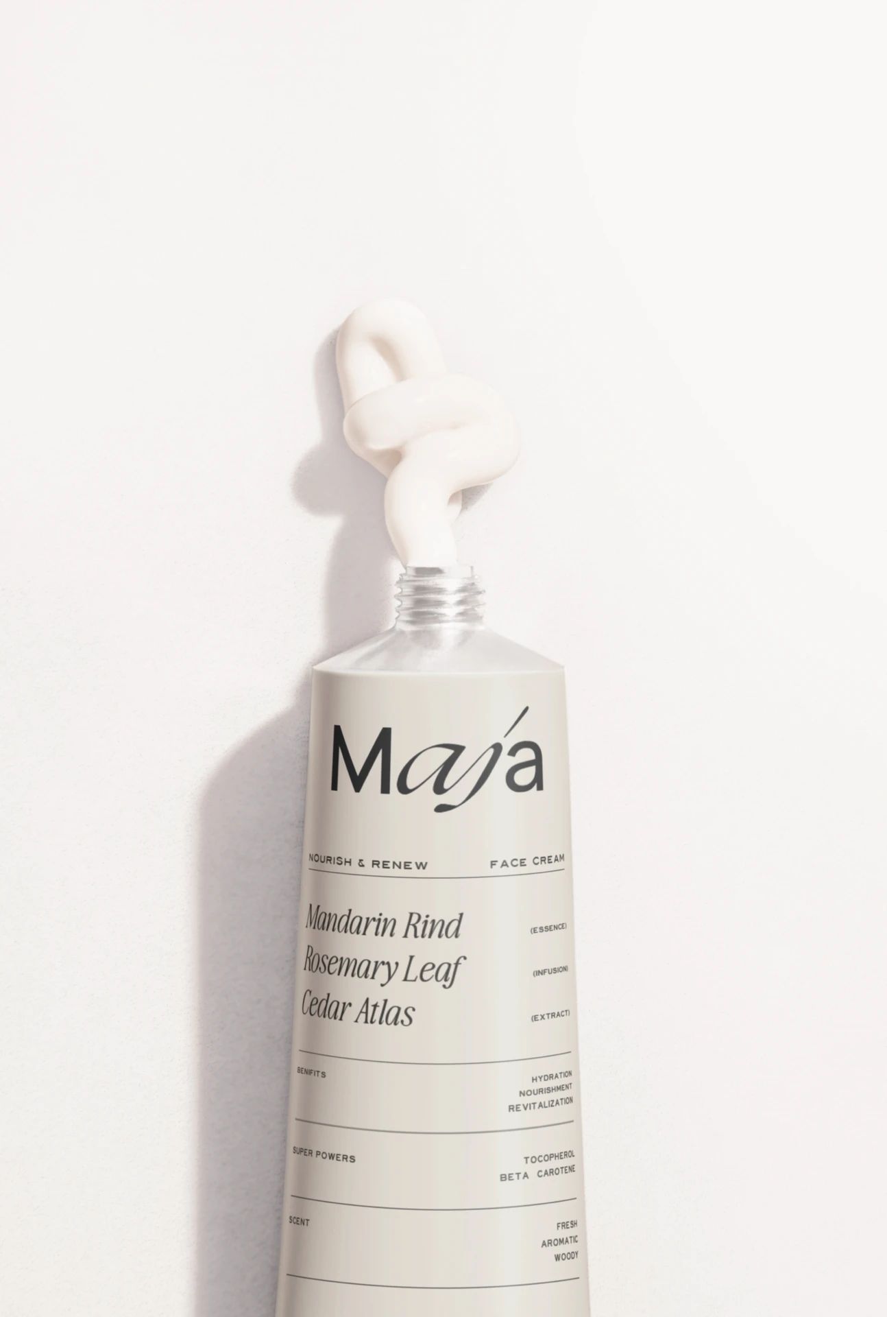 MAJA Bali Boutique Face Cream Packaging – Branding Design by Eeze Studio Minimalist MAJA Bali face cream tube with custom branding, featuring Mandarin Rind, Rosemary Leaf, Cedar Atlas; boutique spa packaging design by Eeze Studio