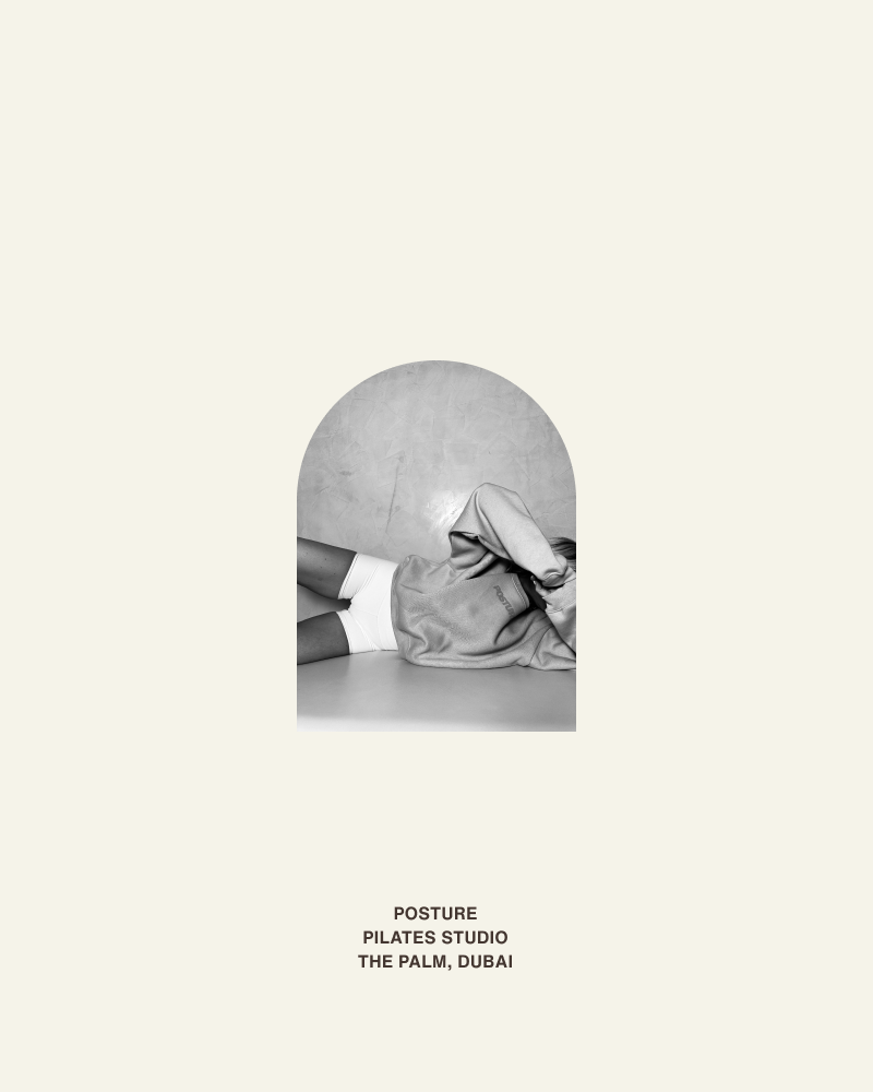 Posture Pilates Studio Dubai – Brand Poster Concept Minimal poster with arched crop of reclining pilates pose and text “Posture Pilates Studio, The Palm, Dubai,” created for studio rebrand and website visuals