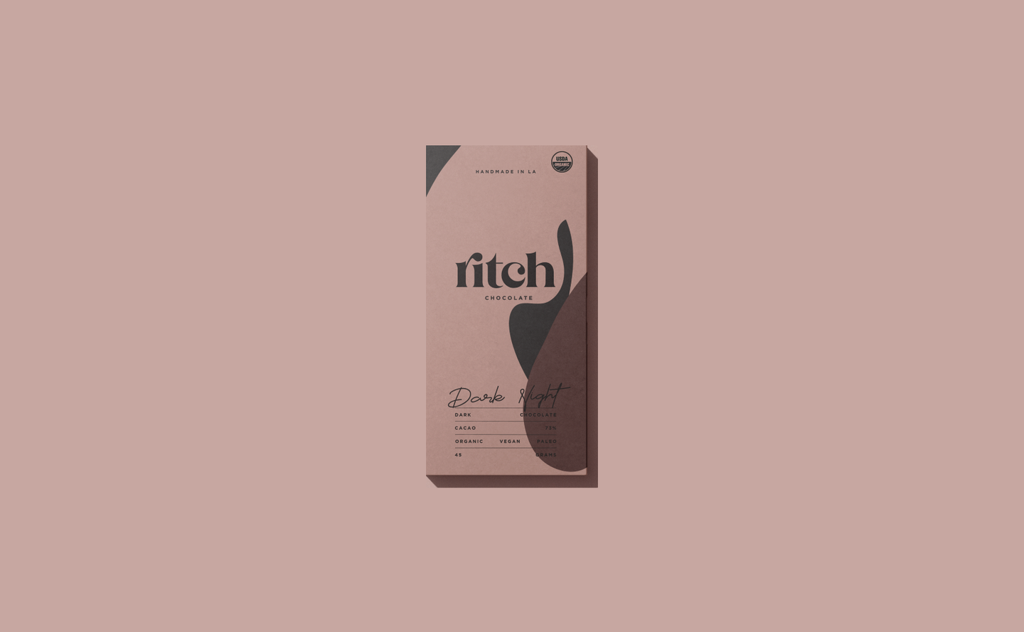 Minimalist packaging design for Ritch Handmade Chocolate’s Dark Night bar, featuring abstract shapes and earthy tones.