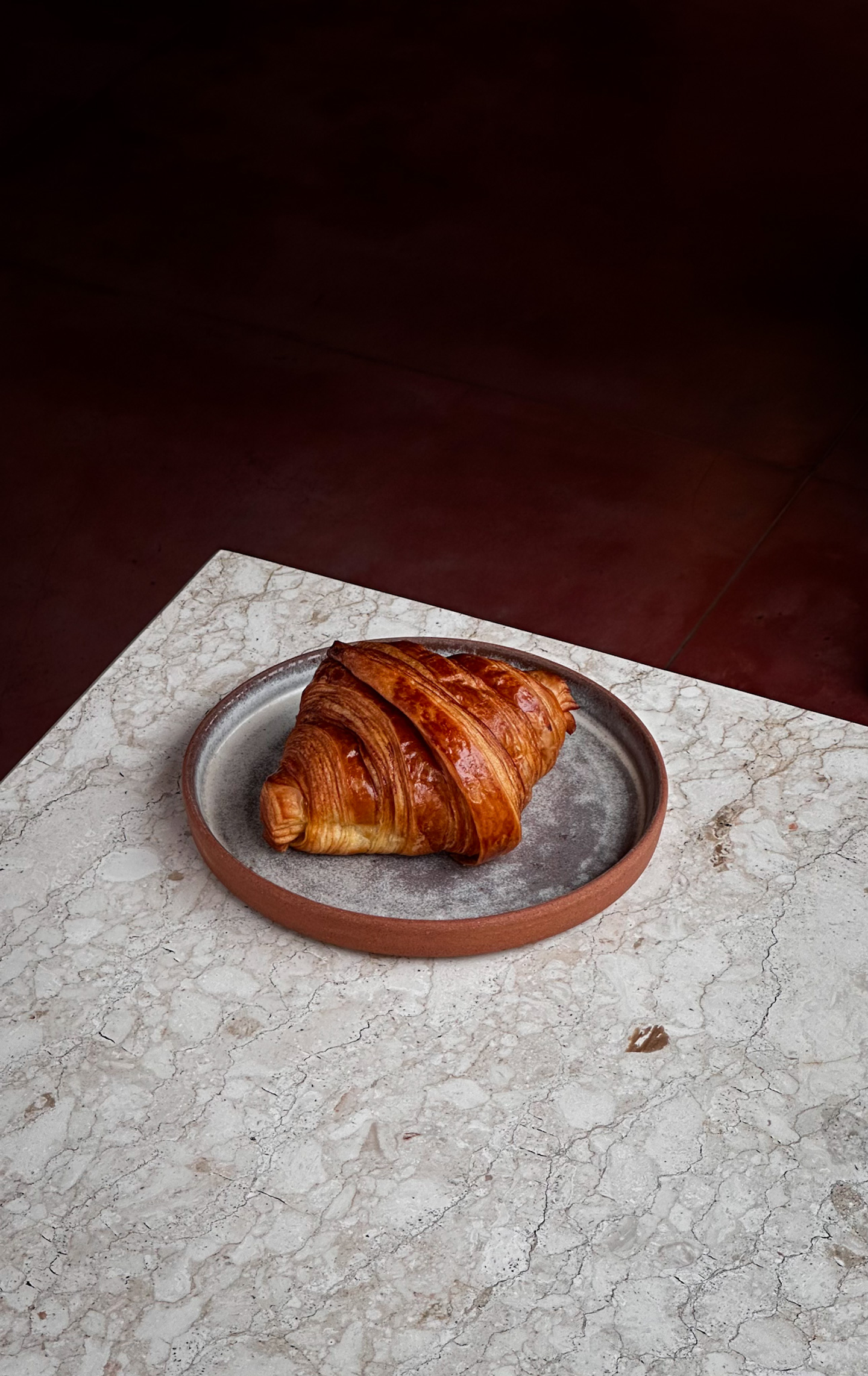 An image of a croissant at Sunday Kitchen, showcasing the creative direction by eeze studio