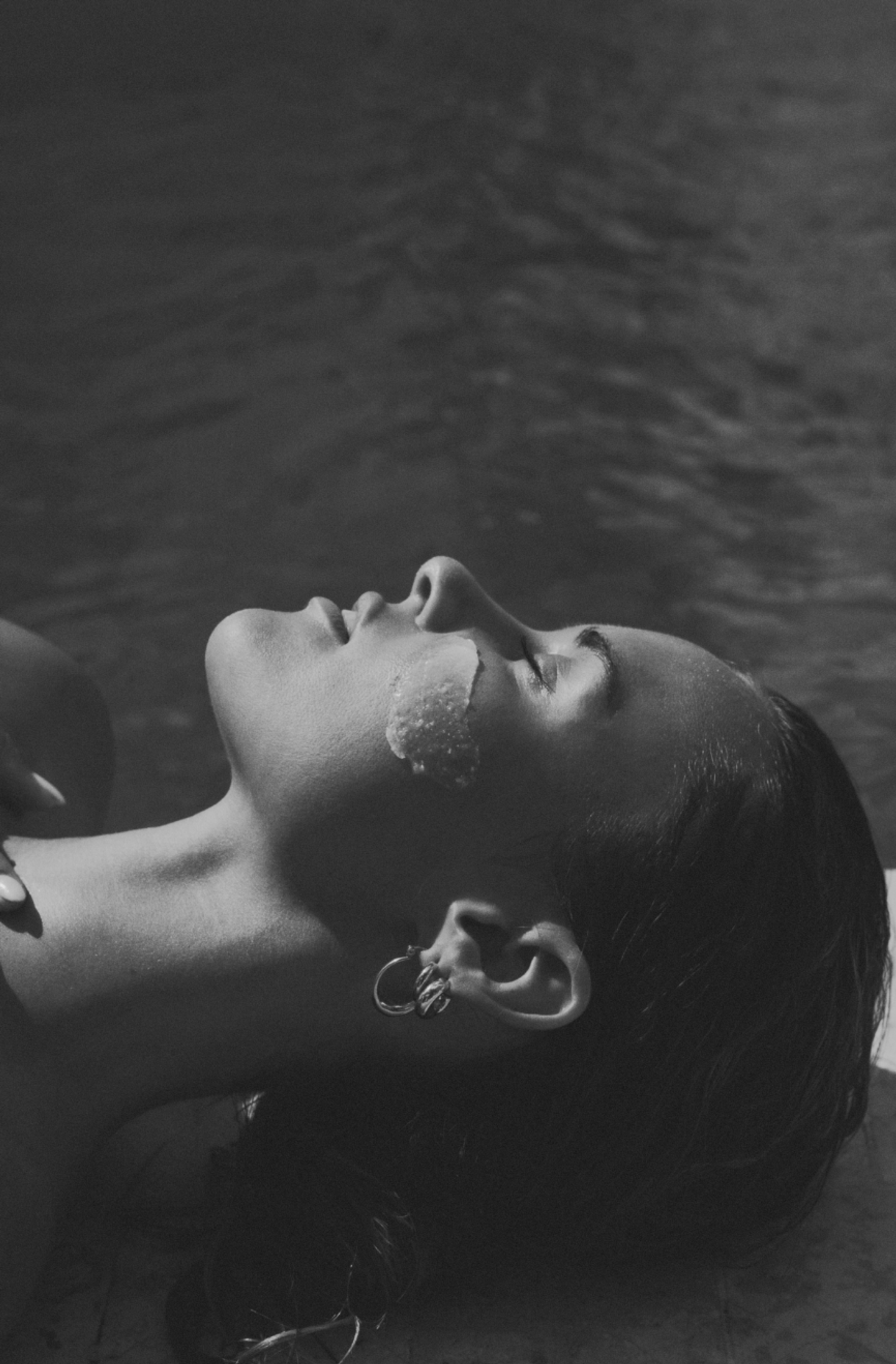 MAJA Bali Spa Poolside Portrait – Wellness Lifestyle Branding Artistic monochrome close-up of a woman beside water at MAJA Bali spa, showcasing minimalist hospitality branding for boutique wellness studio and hotel