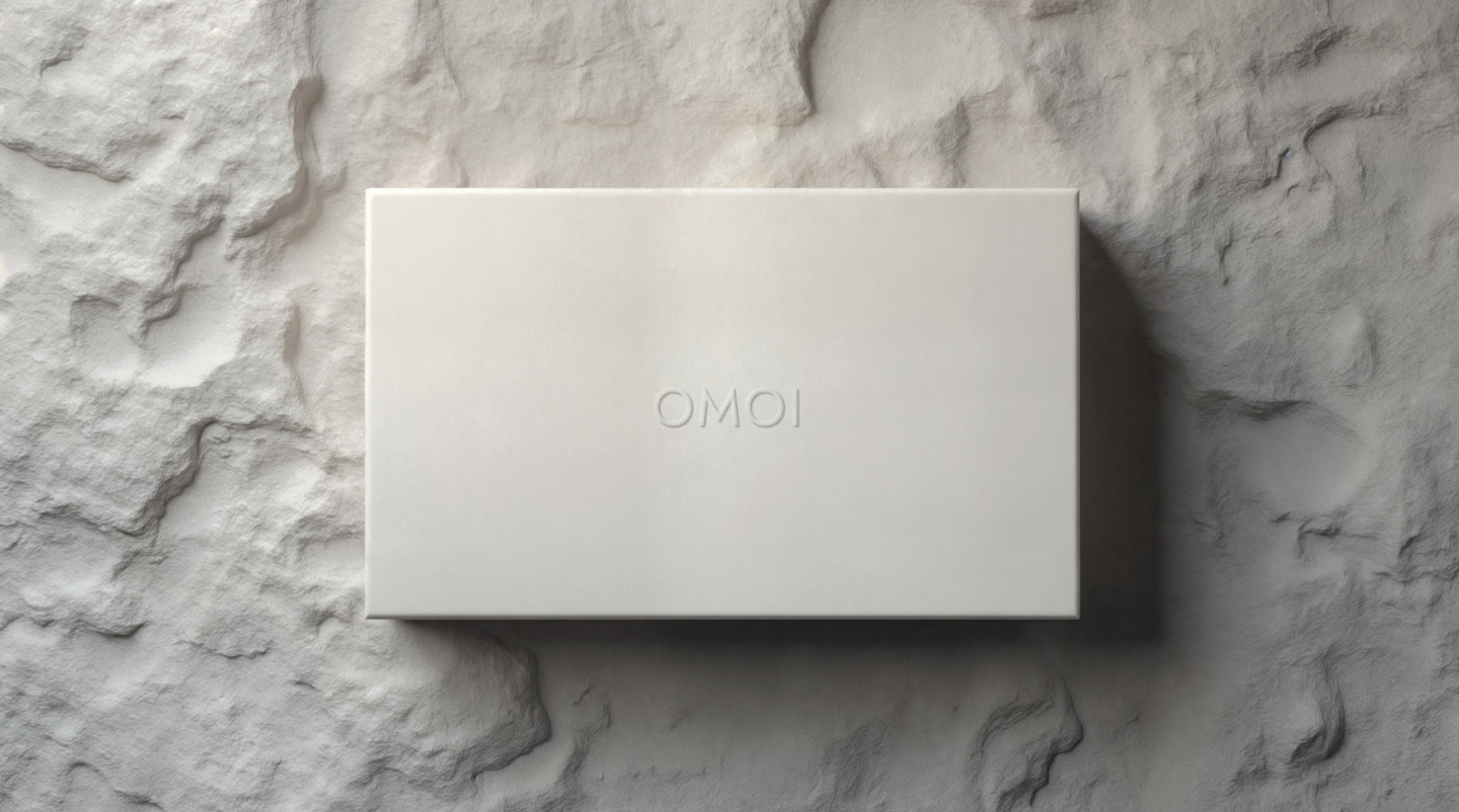 Packaging for OMOI, showing the embroided logo.
