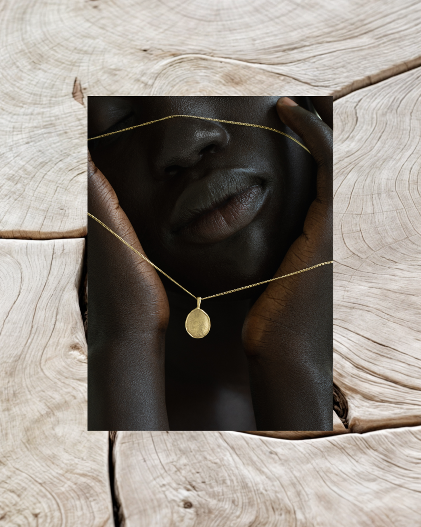 OMOI Jewelry Forever Pendant Collage – Natural Wood Grain Concept by Eeze Studio Editorial collage of OMOI Jewelry gold Forever Pendant over natural wood grain background, produced for branding and Shopify website development by Eeze Studio
