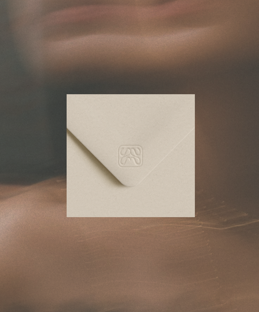 MĀIKA Embossed Packaging Detail – Premium Brand Identity by Eeze Studio Embossed MĀIKA logo on premium cream packaging, detail shot showcasing luxury packaging design and brand identity for MĀIKA by Eeze Studio