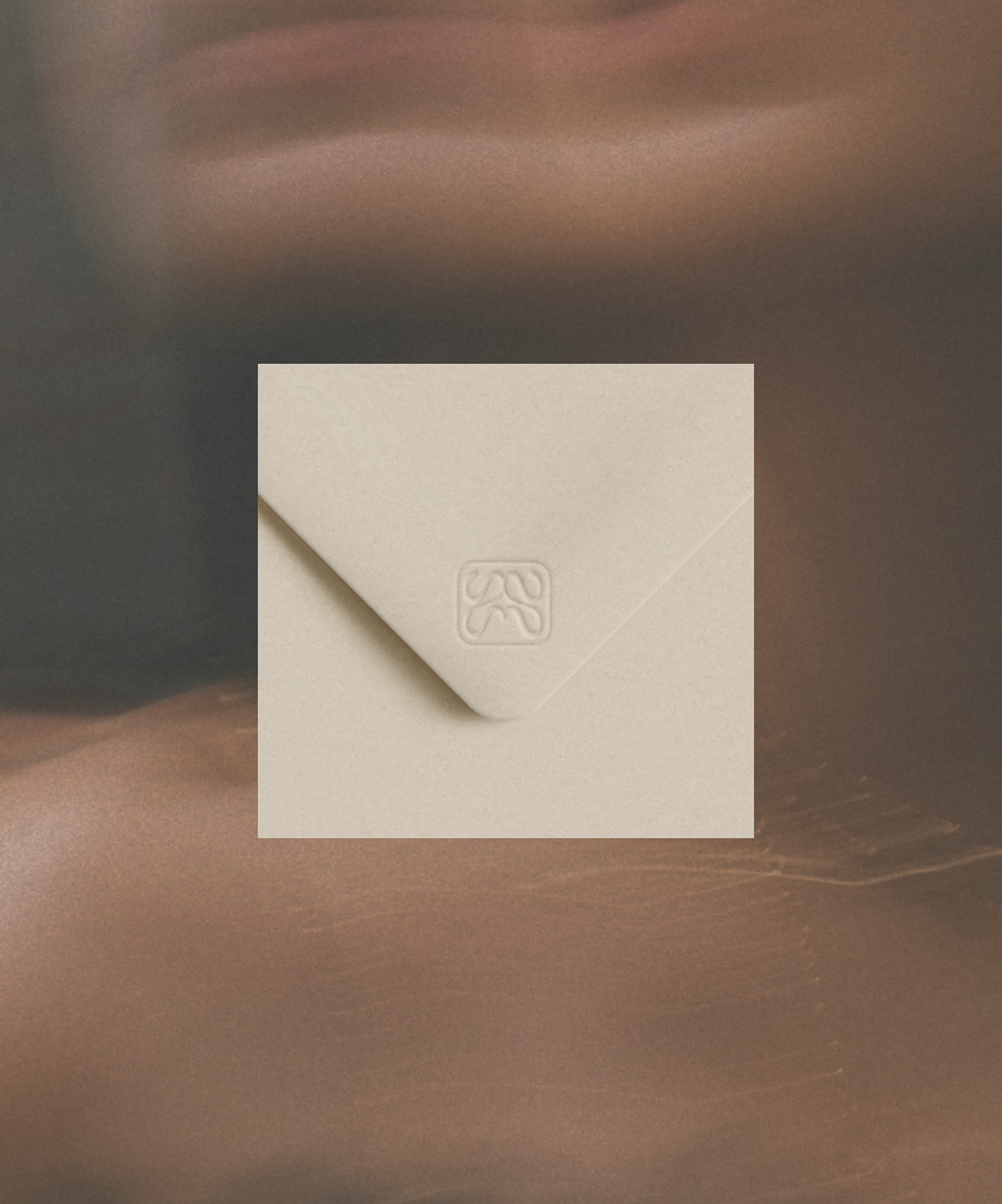 Embossed MĀIKA logo on premium cream packaging, detail shot showcasing luxury packaging design and brand identity for MĀIKA by Eeze Studio