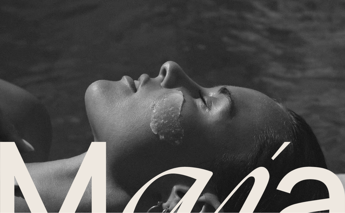 Monochrome artistic campaign visual featuring MAJA Bali poolside experience with bold logo overlay, designed for boutique spa and wellness branding
