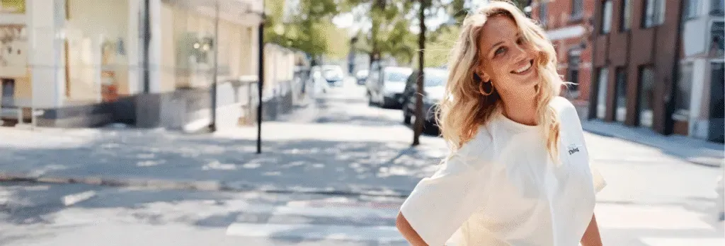 A Bel&Bo customer smiling on a shopping street