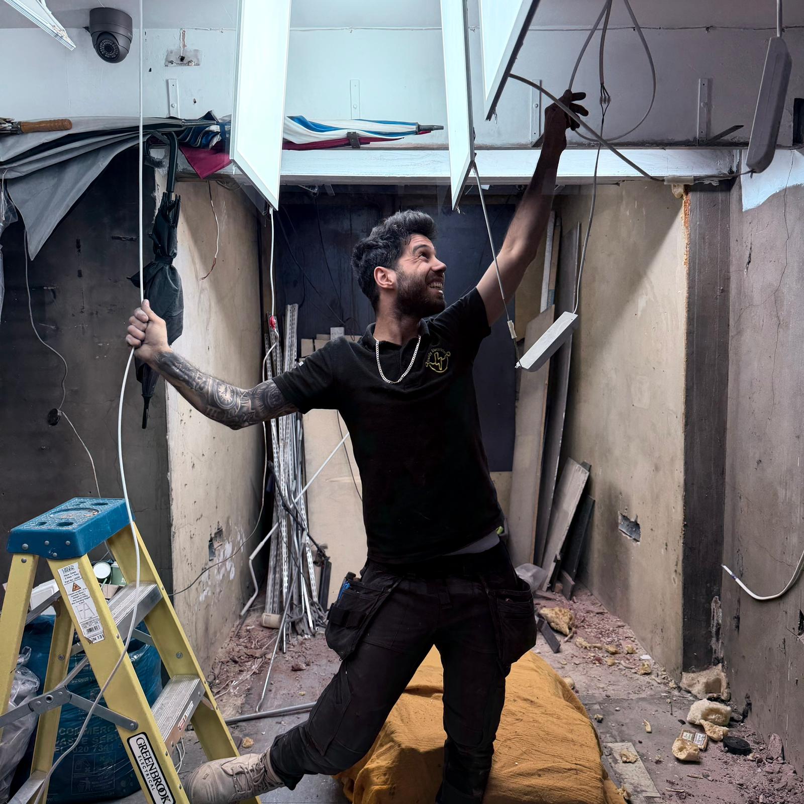 Professional qualified electrician carrying out electrical work in London