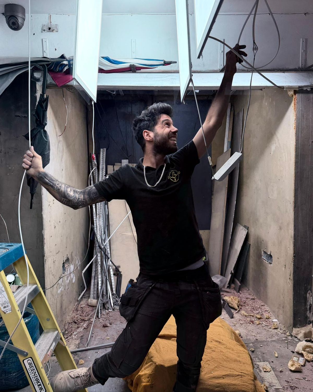 Professional qualified electrician carrying out electrical work in London