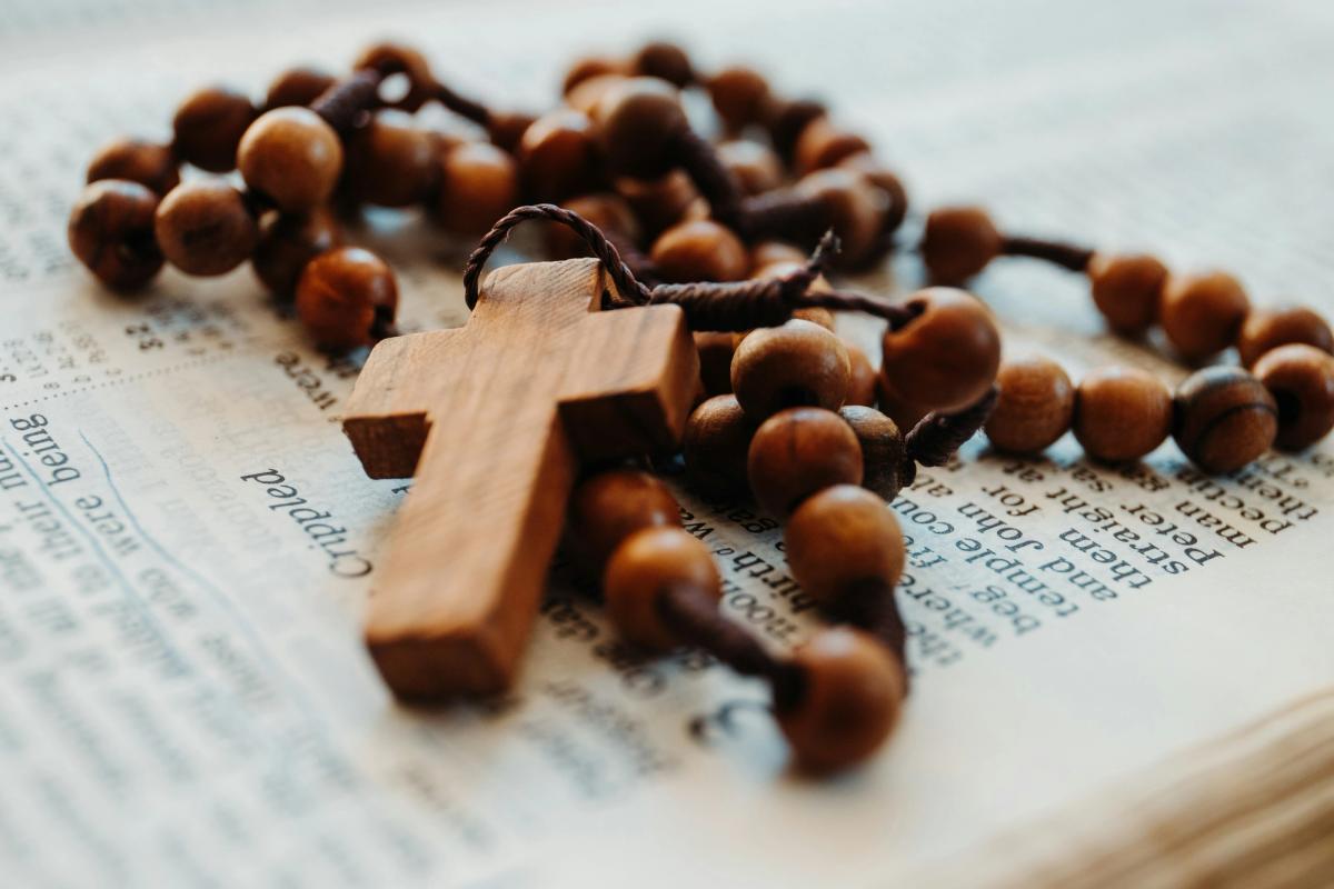 A closeup of a rosary cross