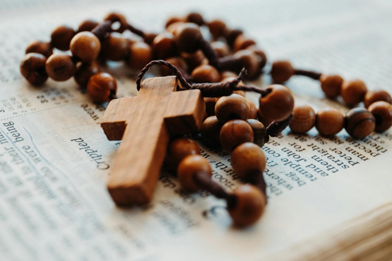 A closeup of a rosary cross