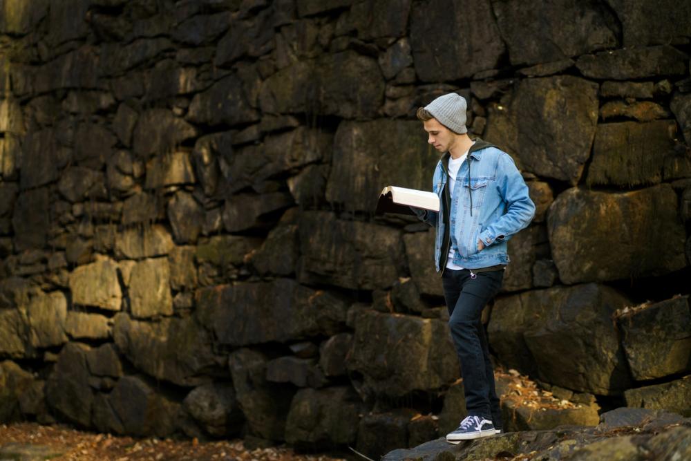 Teenager reading a Bible