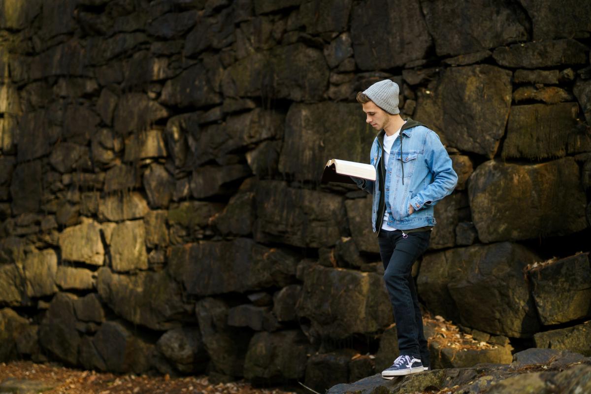 A young person reading the Bible