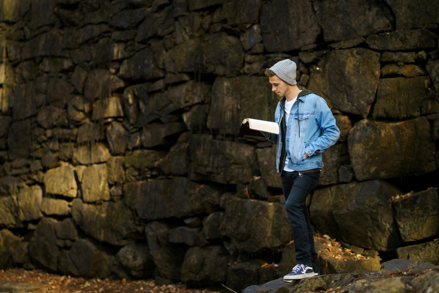 Teenager reading a Bible