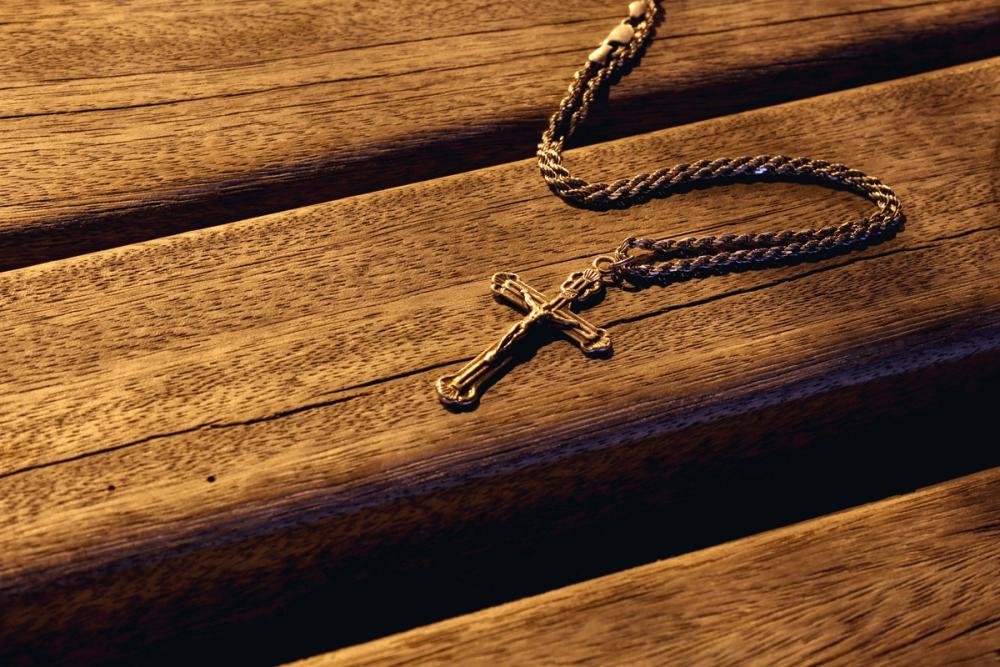 a wooden cross necklace as a meaningful gift