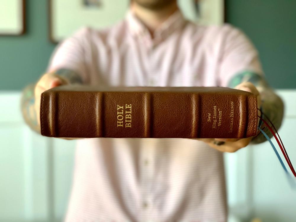 Man Holding a Bible