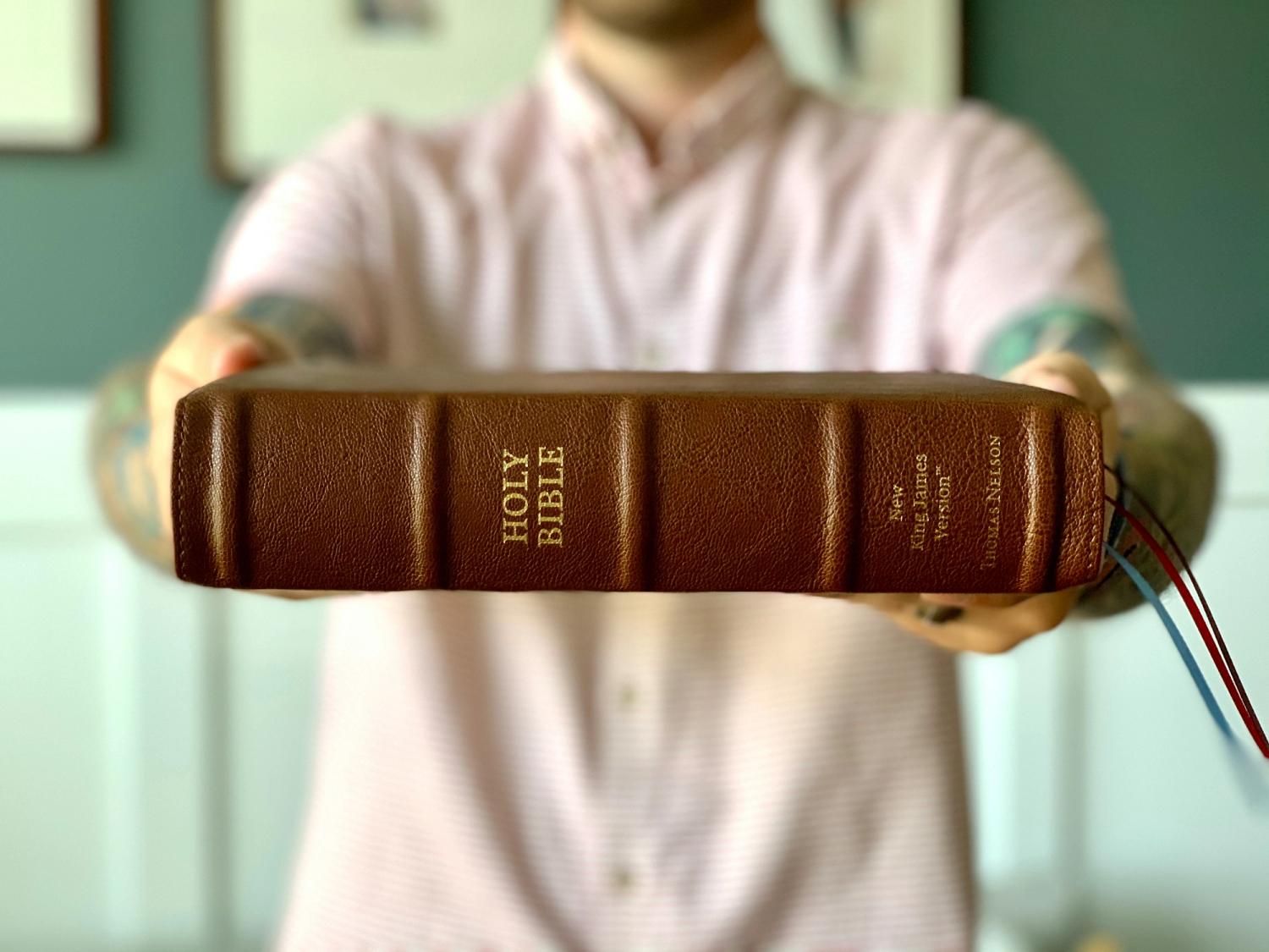 Man Holding a Bible