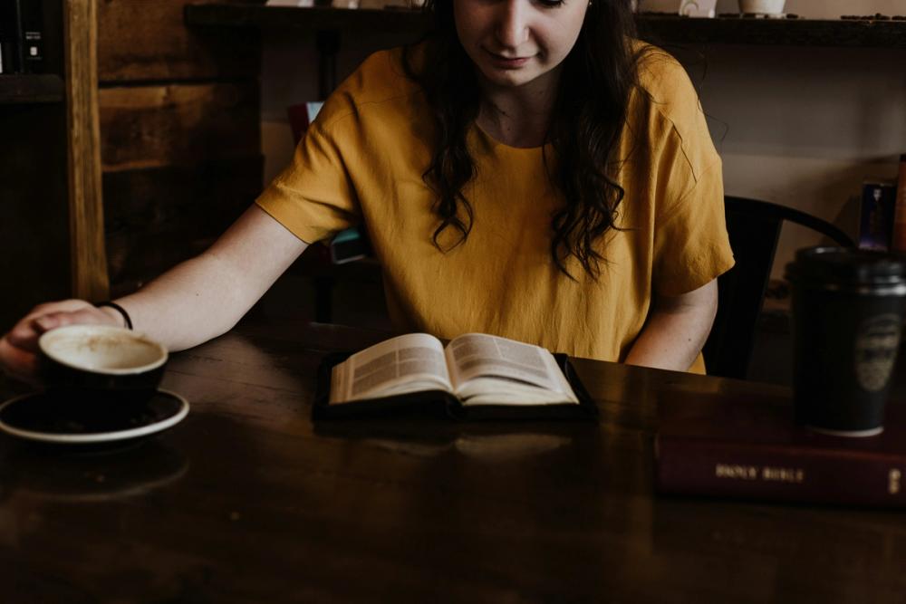 A teenager reading a Bible