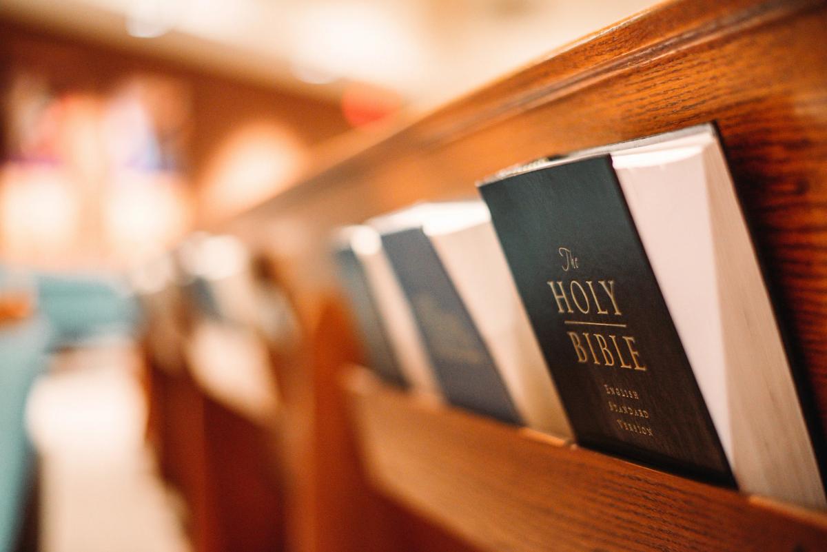 A row of Pew Bibles in a Church Pew