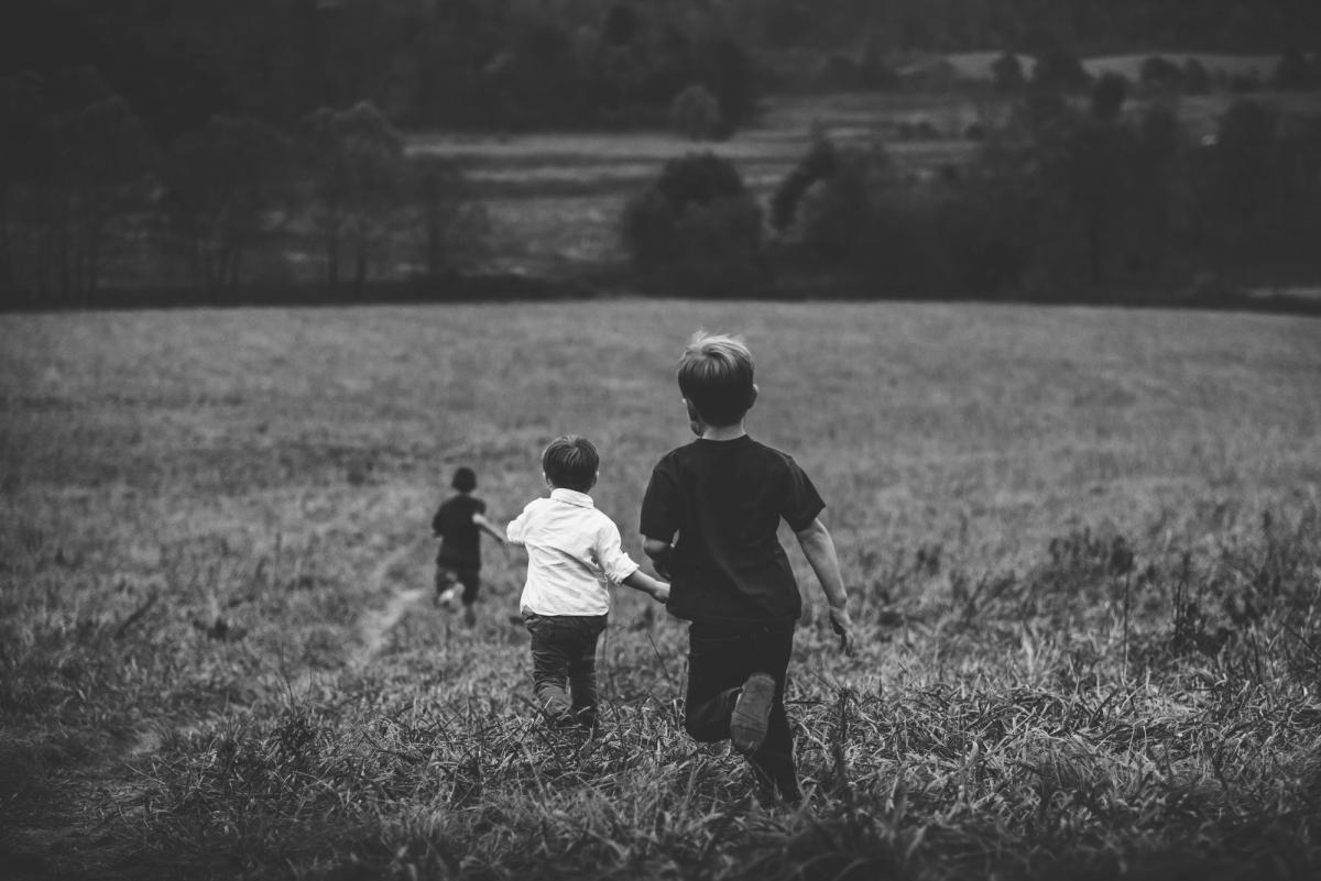 Boys running in a field