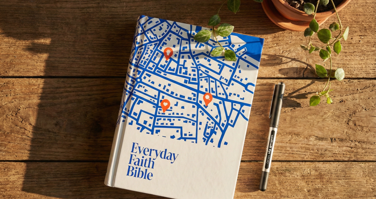 A photo of the NRSV Everyday Faith Bible with a uniball eye pen next to it