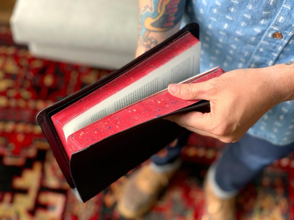 christina man holding a bible gift