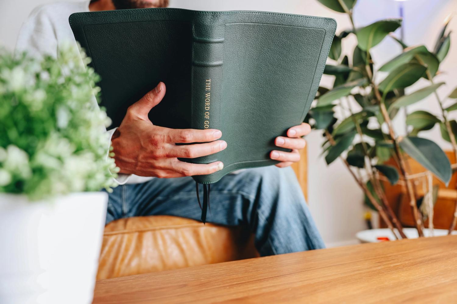 Man Reading an NLT Bible