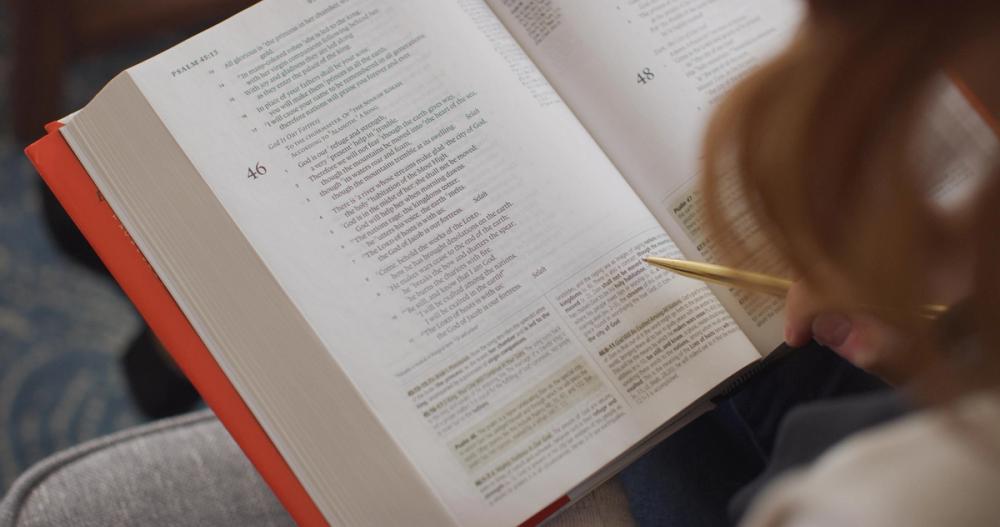 A close-up, angled shot of an open ESV Study Bible page. The focus is sharp on the detailed study notes at the bottom of the page, with the biblical text at the top slightly out of focus. This visually demonstrates the depth of information provided. Image courtesy of Crossway