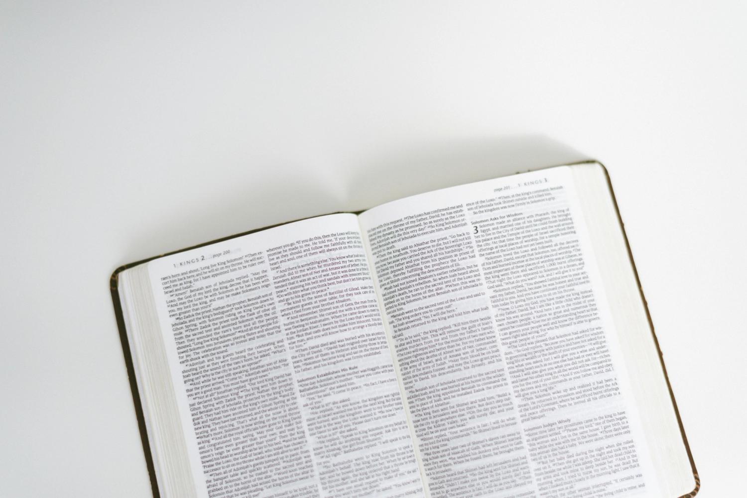 An open Bible on a white background