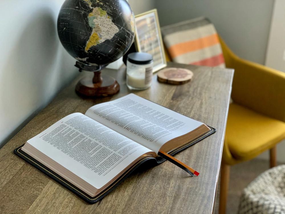 A CSB Bible open on a desk