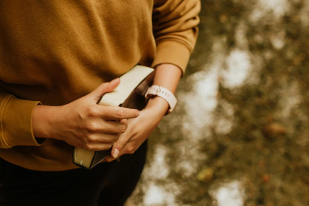 Man Carrying Bible