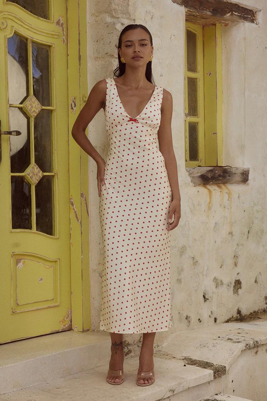 Girl in red polka dot maxi dress