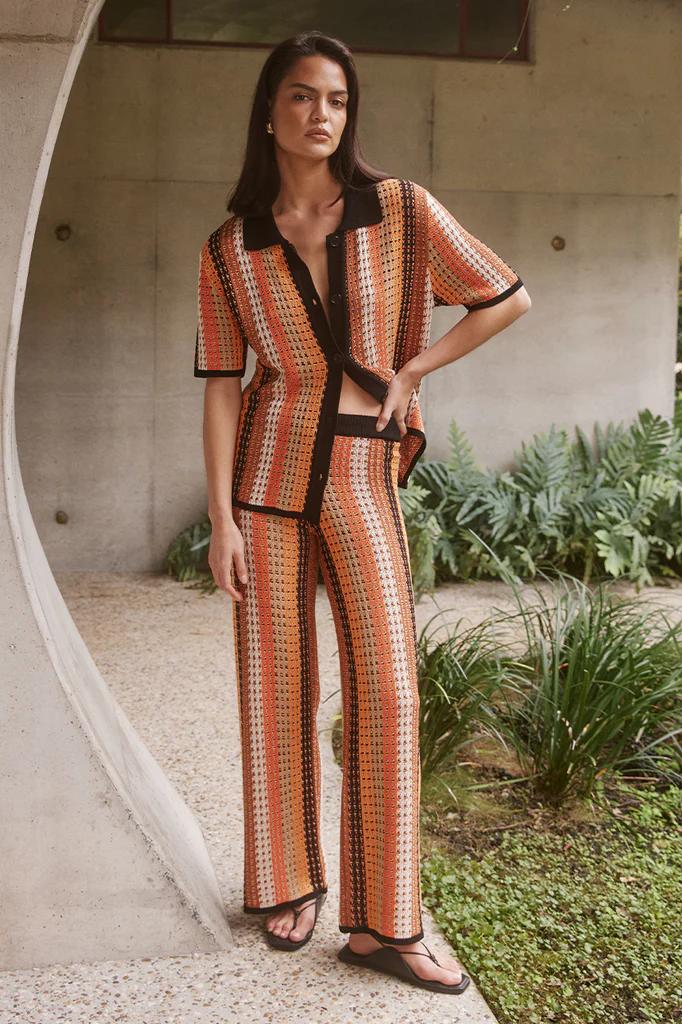 Woman in orange and brown crochet set
