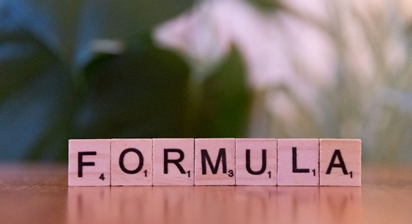 FORMULA SPELLED OUT WITH SCRABBLE TILES
