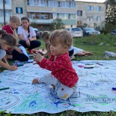 children making a map on the grass