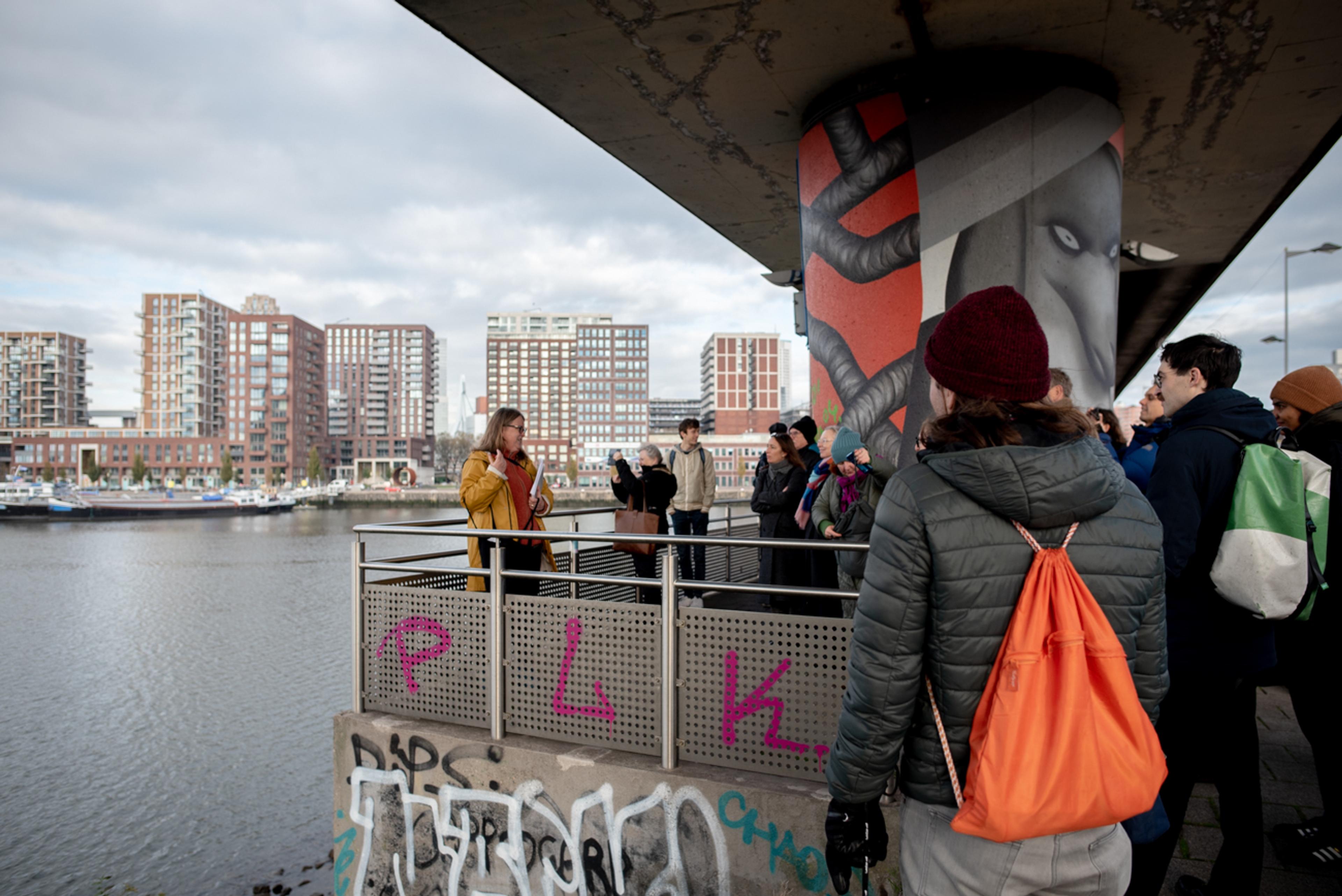 Group of people on a bridge near water