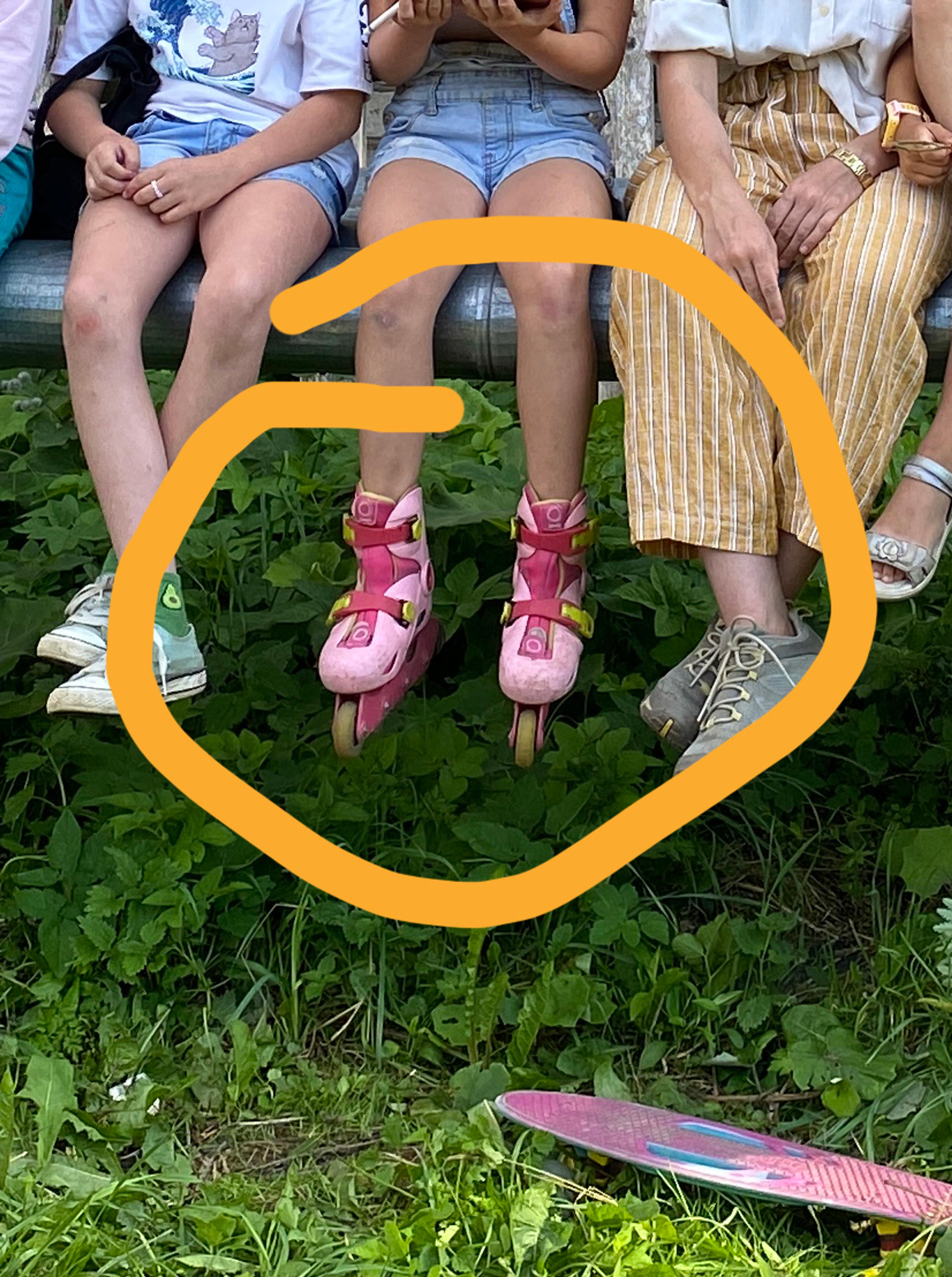 detail of group portrait photo, rollerskates circled. 