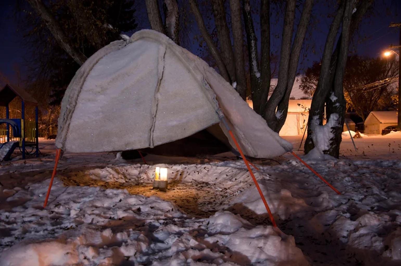 canvas hut in the middle of a winter setting