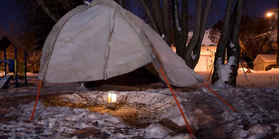 canvas hut in the middle of a winter setting