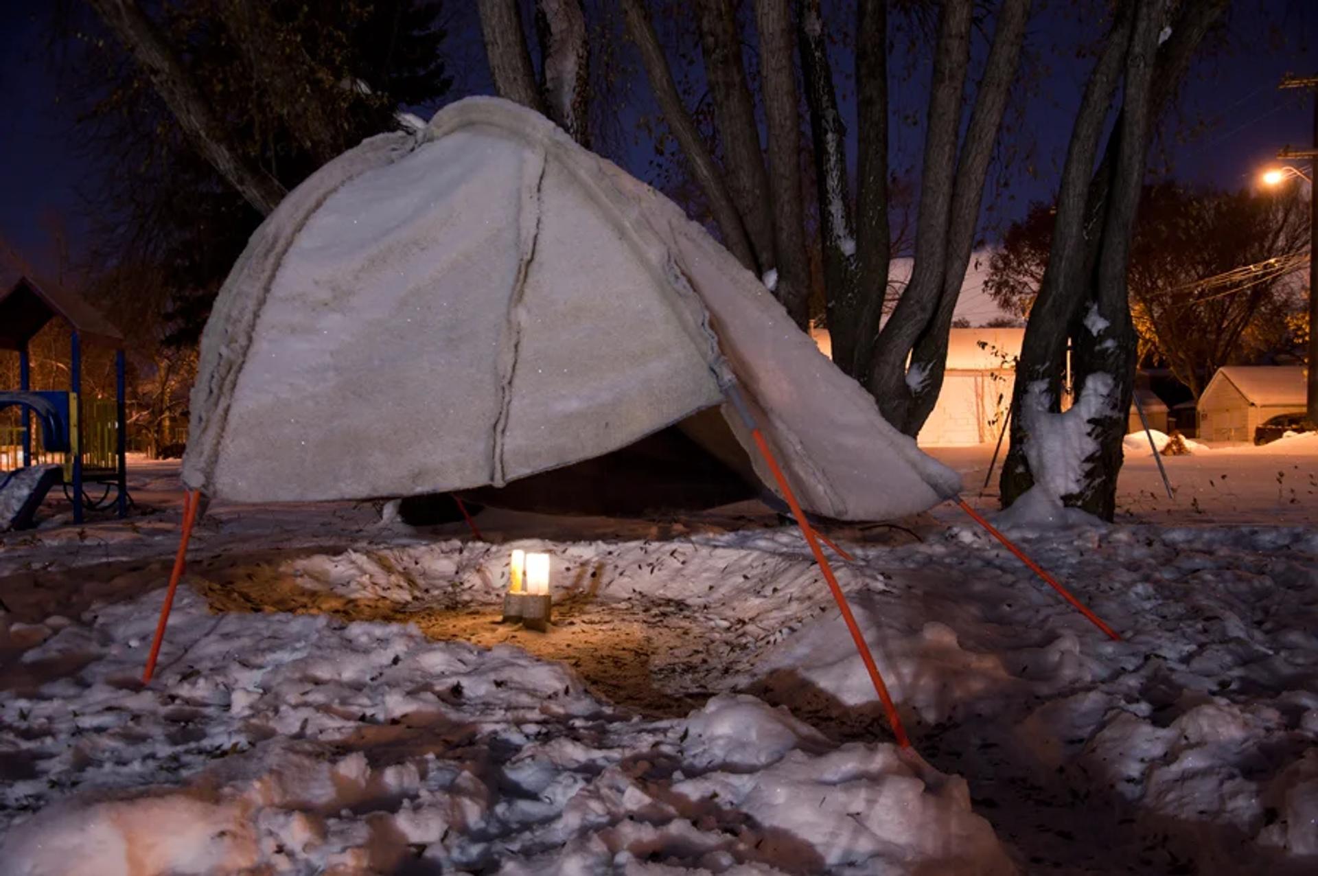 canvas hut in the middle of a winter setting