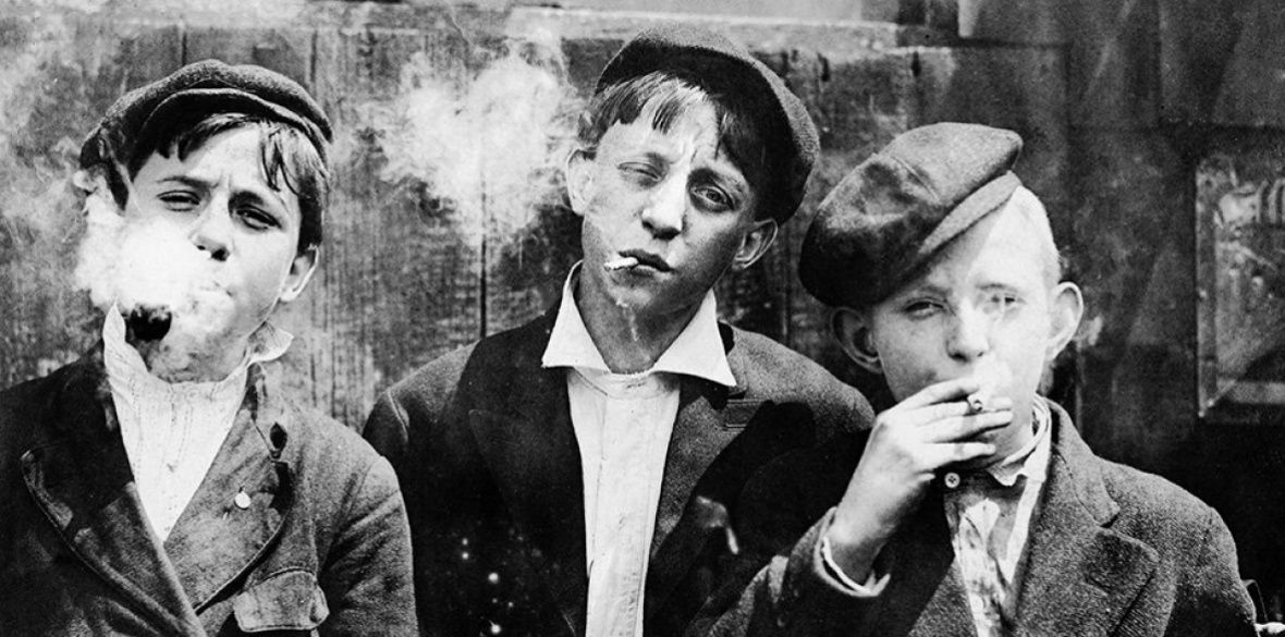 11:00 A.M. Monday, May 9th, 1910. Newsies at Skeeter’s Branch, Jefferson near Franklin. They were all smoking. St. Louis, Missouri, 1910 Photo: Lewis W Hine