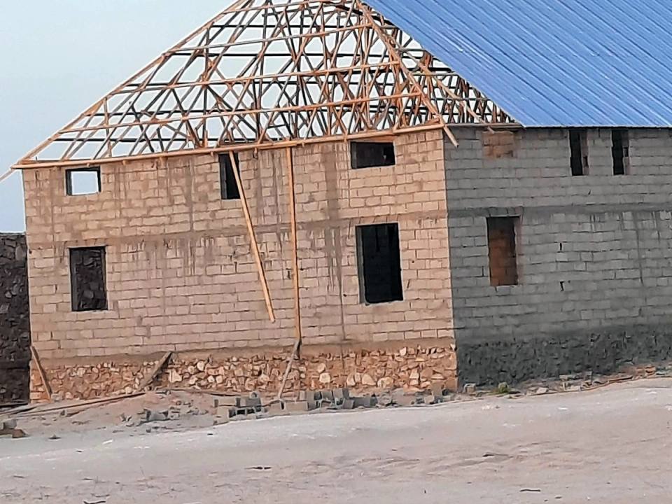 The first building taking shape, its roof frame going up, 2021.