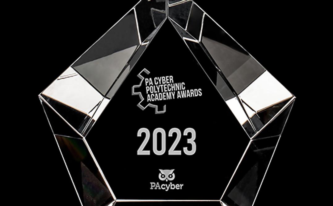 The Poly Award, a glass trophy in the shape of a pentagon with the award's title engraved into it