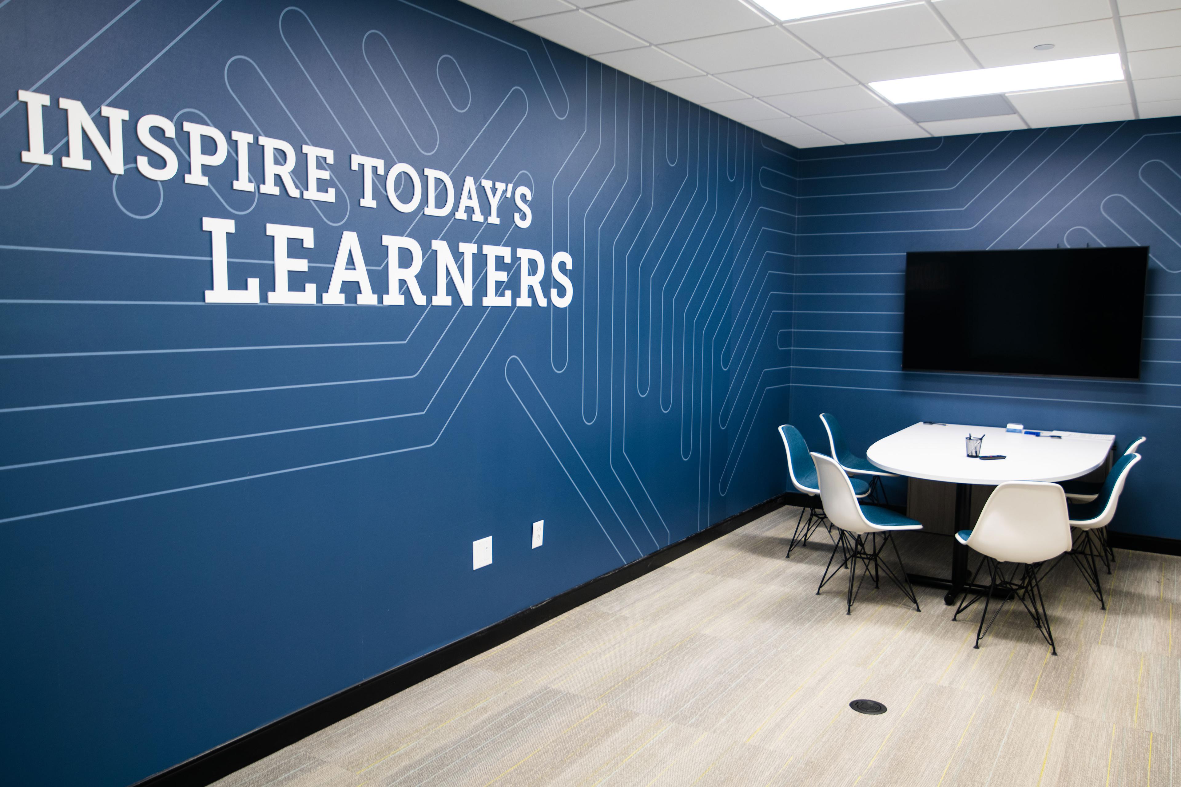 Conference room with the words Inspire Today's Learners on the wall